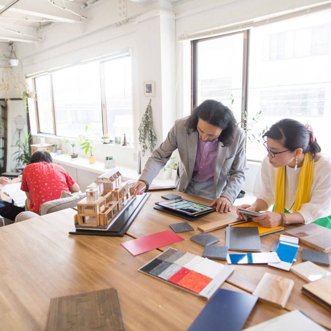 A man and a woman at their architectural business