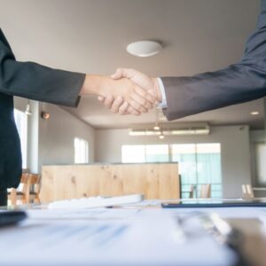 photo of two business people shaking hands